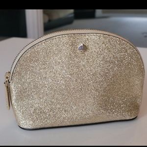 Gold Kate Spade makeup bag